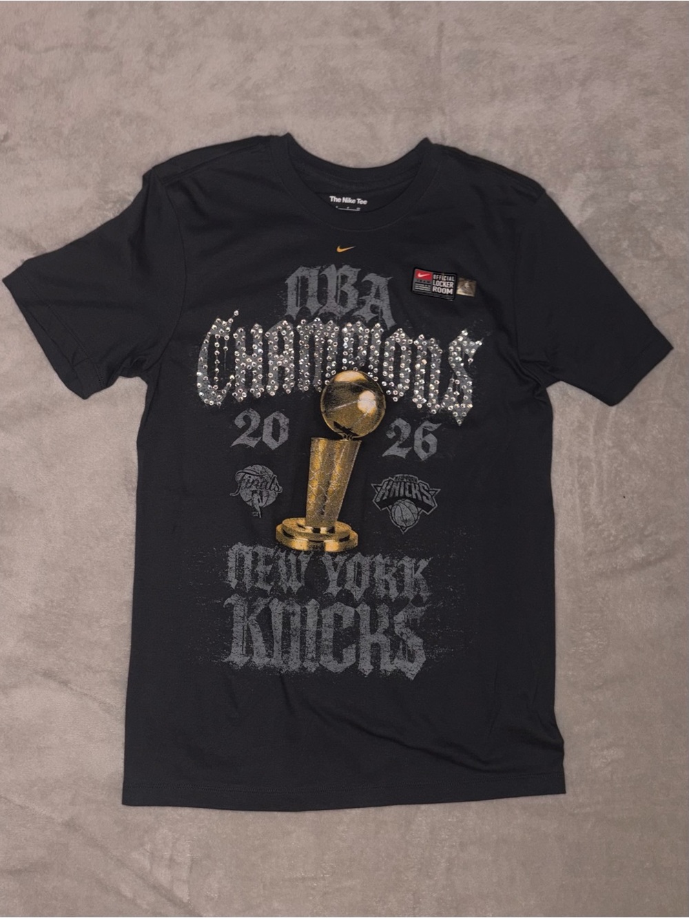Nike Black New York Knicks NBA Champions Graphic Tee with Gold Trophy